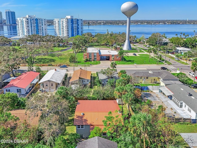 drone / aerial view featuring a view of city and a water view