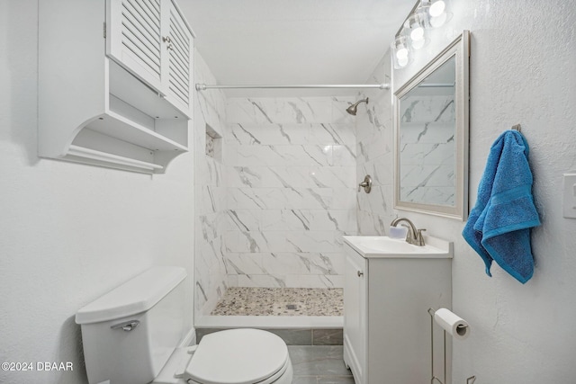 full bath featuring vanity, toilet, and a stall shower