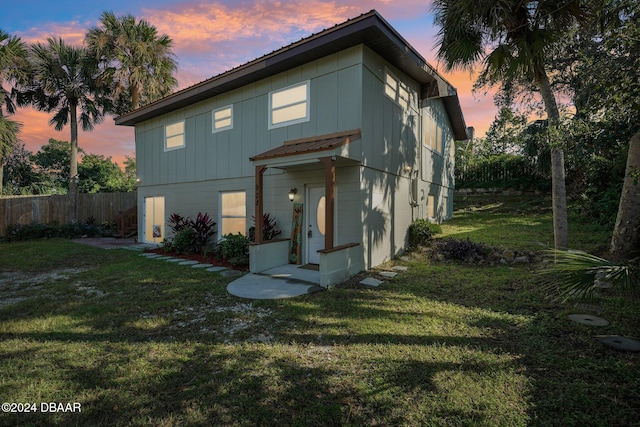 view of front of house with a lawn