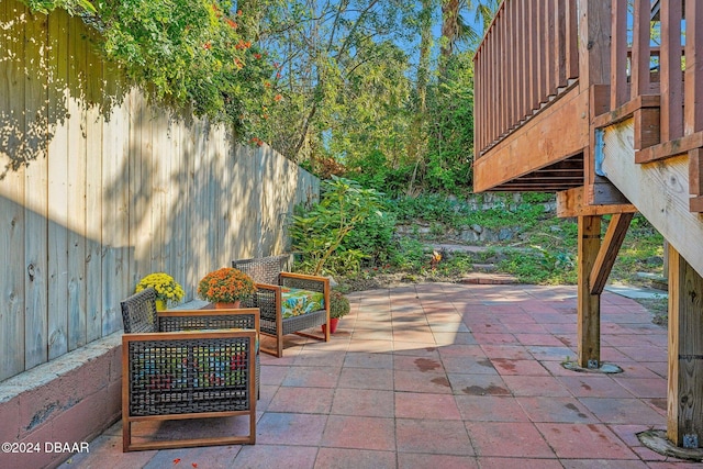 view of patio / terrace featuring fence