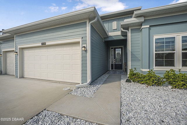 entrance to property featuring a garage