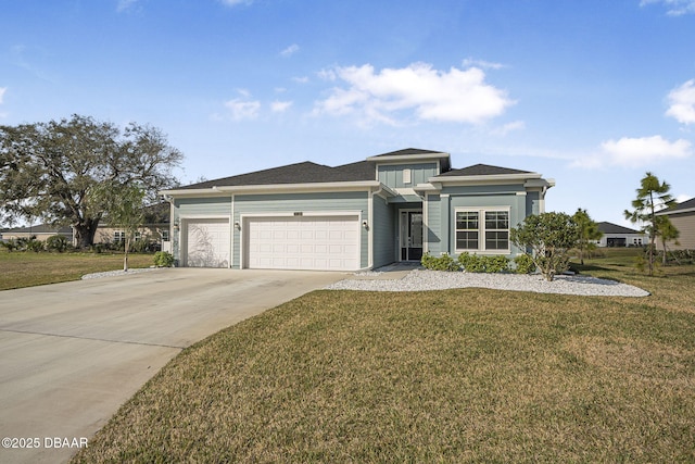 view of front of home featuring a garage and a front lawn