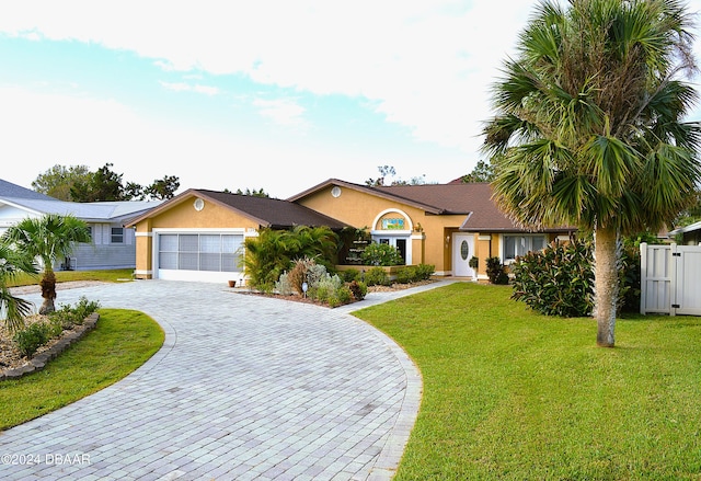 ranch-style home with a garage and a front lawn