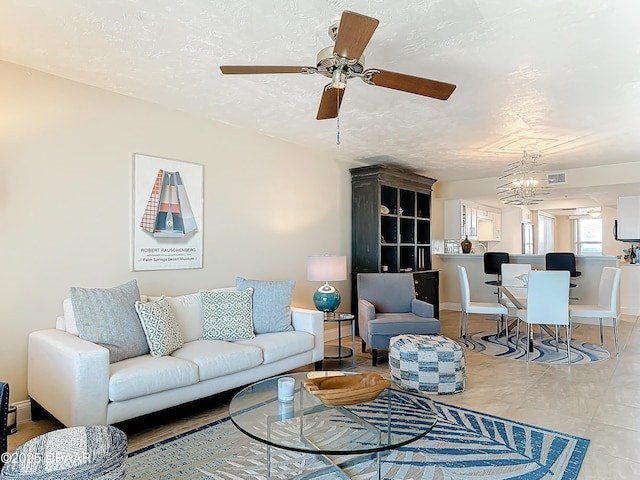 3333 S Atlantic Ave Unit 505, Daytona Beach, FL 32118 - living room featuring a ceiling fan and baseboards