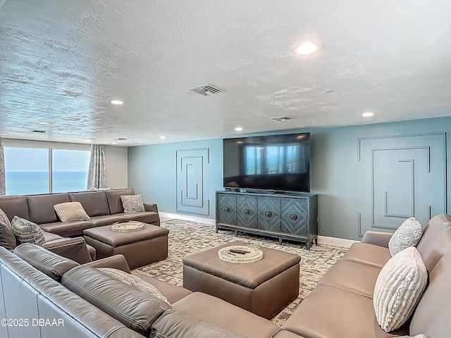 3333 S Atlantic Ave Unit 505, Daytona Beach, FL 32118 - living room featuring baseboards and recessed lighting