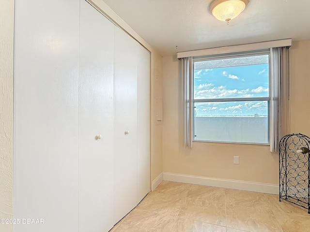 3333 S Atlantic Ave Unit 505, Daytona Beach, FL 32118 - unfurnished bedroom featuring a closet and baseboards