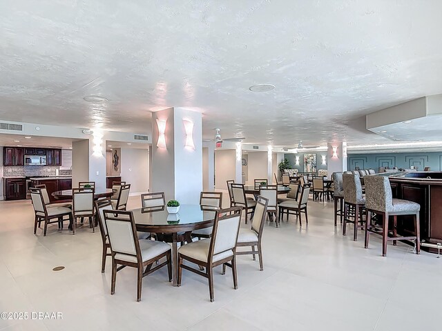 3333 S Atlantic Ave Unit 505, Daytona Beach, FL 32118 - dining area with a textured ceiling