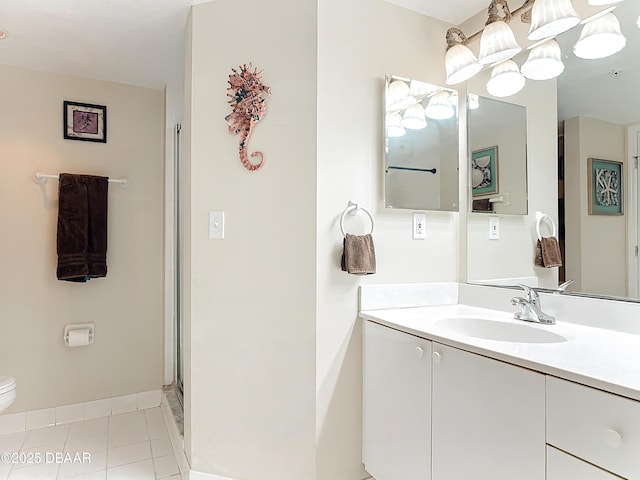 3333 S Atlantic Ave Unit 505, Daytona Beach, FL 32118 - bathroom featuring vanity, toilet, baseboards, tile patterned flooring, and an enclosed shower