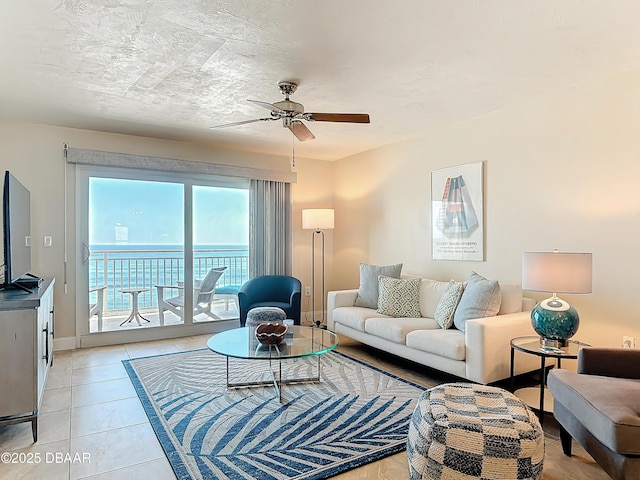 3333 S Atlantic Ave Unit 505, Daytona Beach, FL 32118 - living room featuring ceiling fan and light tile patterned flooring