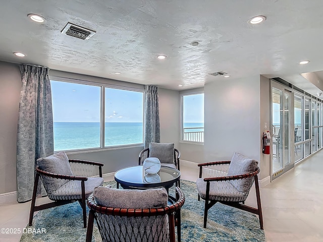 3333 S Atlantic Ave Unit 505, Daytona Beach, FL 32118 - sitting room featuring recessed lighting, baseboards, and a water view
