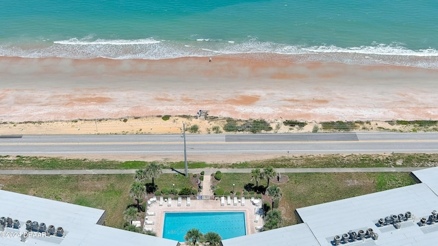 aerial view featuring a water view and a view of the beach