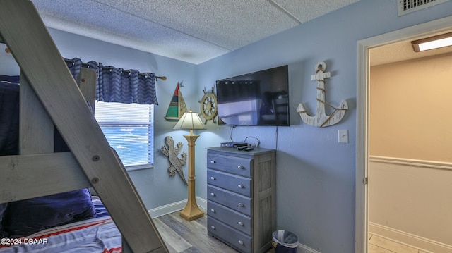 bedroom with light hardwood / wood-style floors