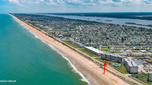 birds eye view of property featuring a view of the beach and a water view