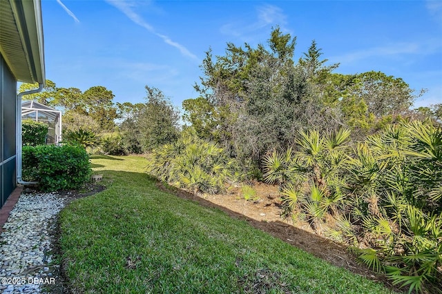 view of yard featuring a lanai