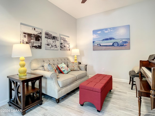 living room featuring hardwood / wood-style floors and ceiling fan