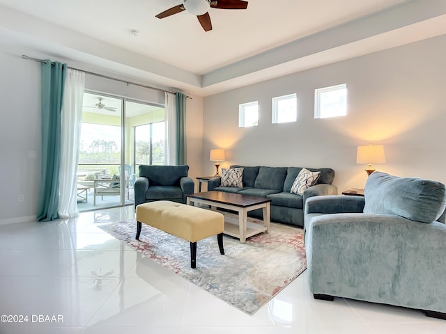 tiled living room with ceiling fan