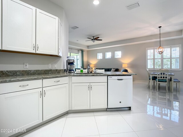 kitchen featuring dishwasher, white cabinets, sink, ceiling fan, and light tile patterned floors