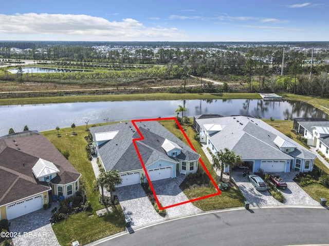 birds eye view of property with a water view