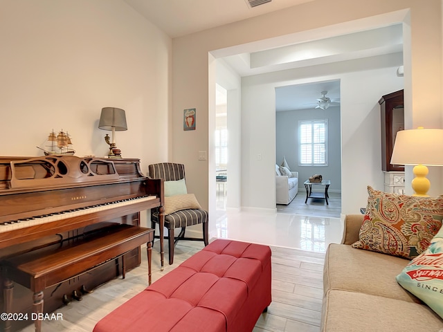 interior space with ceiling fan