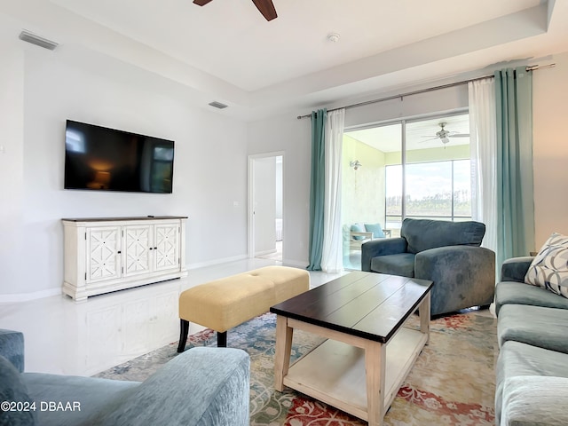 living room featuring a raised ceiling