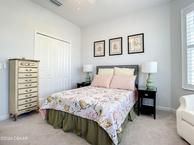 carpeted bedroom with a closet