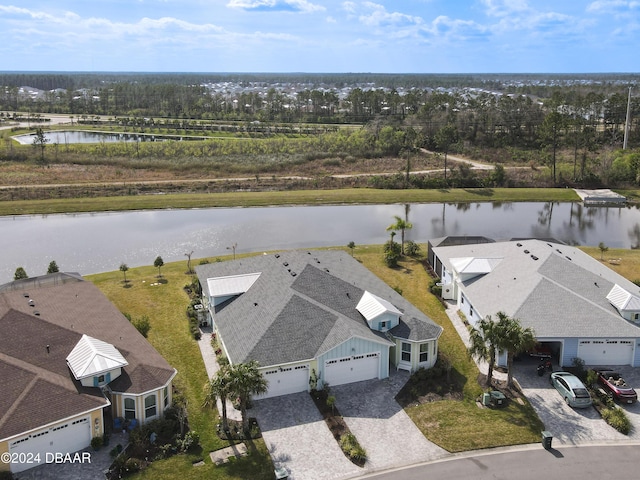 birds eye view of property with a water view