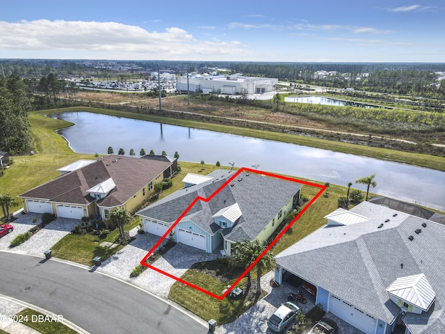 birds eye view of property with a water view