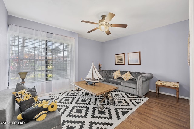 living room with hardwood / wood-style floors and ceiling fan