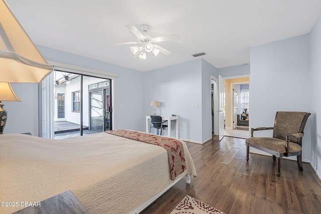 bedroom with access to outside, dark hardwood / wood-style floors, and ceiling fan