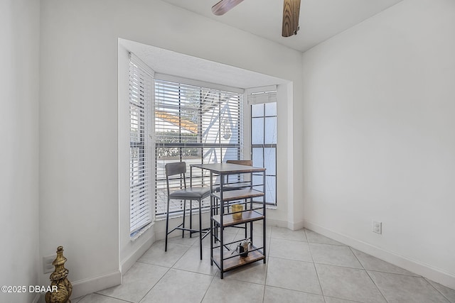 dining space featuring light tile patterned floors and ceiling fan