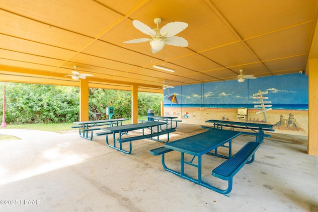 view of property's community featuring a patio area and outdoor dining space