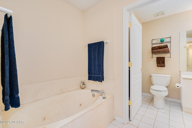 bathroom with tile patterned flooring, a whirlpool tub, visible vents, toilet, and baseboards