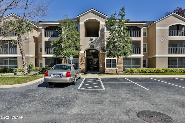 940 Village Trl Unit 6-305, Port Orange, FL 32127 - view of property with uncovered parking