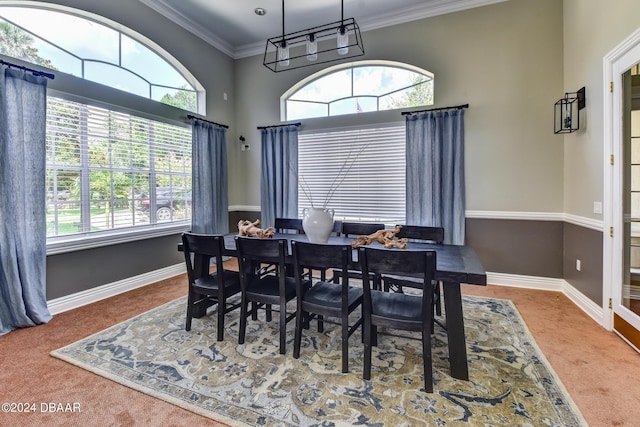 940 Village Trl Unit 6-305, Port Orange, FL 32127 - carpeted dining room featuring plenty of natural light and crown molding