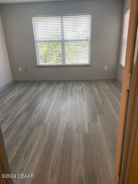 940 Village Trl Unit 6-305, Port Orange, FL 32127 - empty room featuring wood finished floors