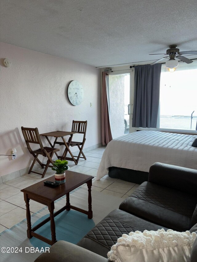 3501 S Atlantic Ave E Unit G20, Daytona Beach Shores, FL 32118 - bedroom with light tile patterned floors and a textured ceiling