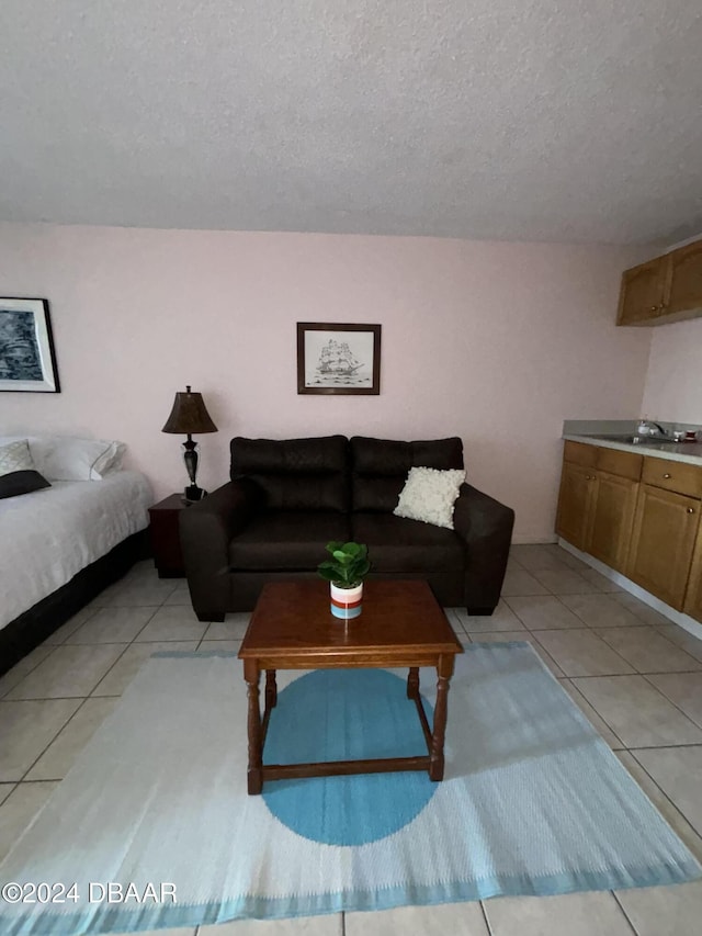 3501 S Atlantic Ave E Unit G20, Daytona Beach Shores, FL 32118 - living area featuring a textured ceiling and light tile patterned floors