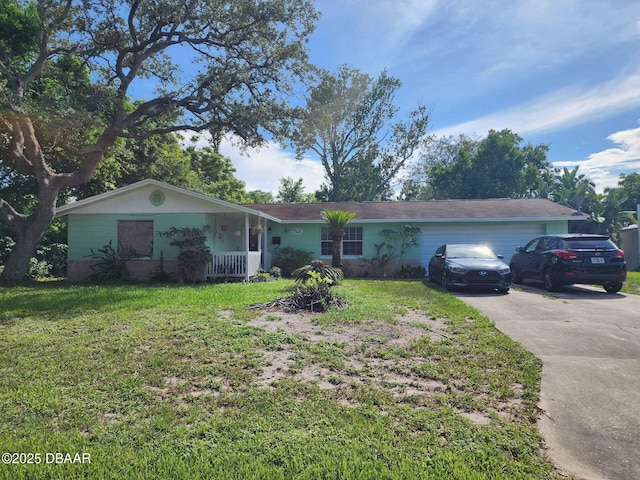 1528 Valencia Ave, Daytona Beach, FL 32117 - ranch-style home featuring a front lawn, a garage, and driveway