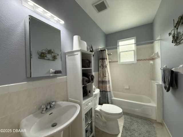 415 Jessamine Ave, New Smyrna Beach, FL 32169 - full bath with a sink, tile patterned floors, shower / tub combo with curtain, and toilet