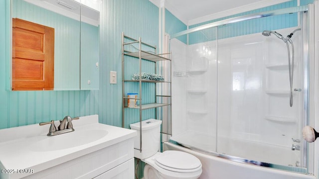 full bathroom featuring vanity, crown molding, shower / bath combination with glass door, and toilet