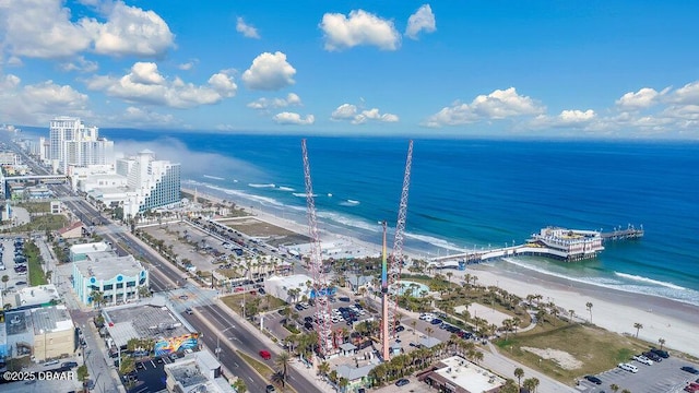 drone / aerial view featuring a view of the beach and a water view