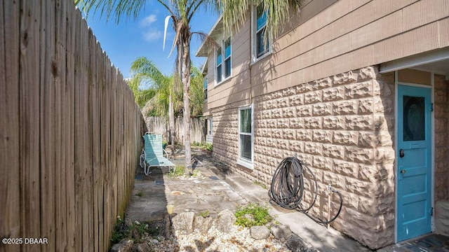 view of property exterior with a patio