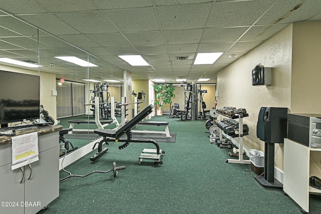 gym featuring a paneled ceiling