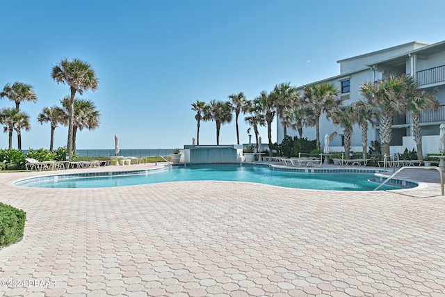 view of swimming pool with a patio