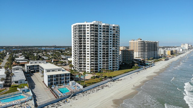 birds eye view of property with a view of the beach and a water view