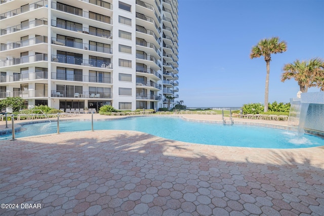 view of pool featuring pool water feature