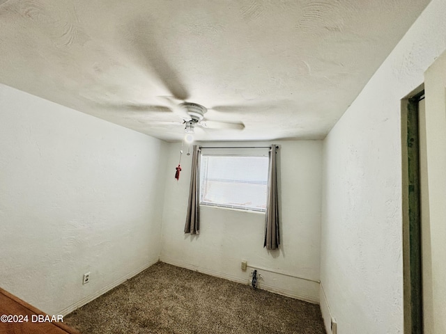 unfurnished room featuring a textured ceiling, carpet floors, and ceiling fan