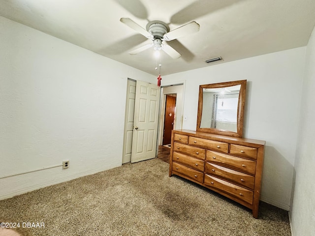 bedroom with carpet flooring, ceiling fan, and a closet