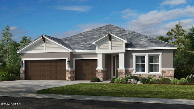 craftsman-style house featuring a garage and a front lawn