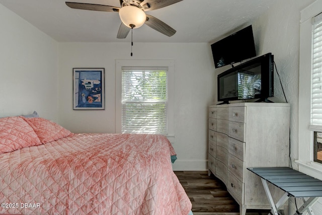 bedroom with dark hardwood / wood-style floors